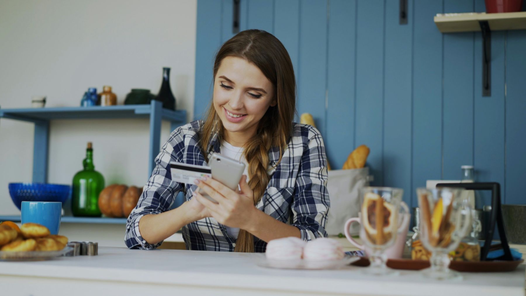 A guest paying for an upgrade on her phone